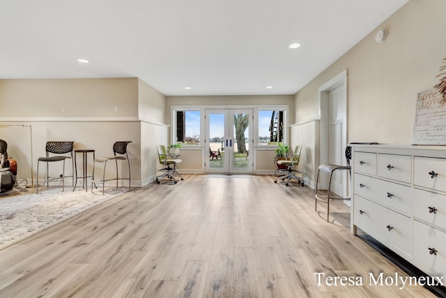 living area featuring recessed lighting, french doors, baseboards, and light wood-style flooring