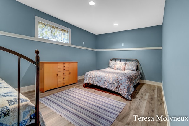 bedroom featuring recessed lighting, baseboards, and wood finished floors