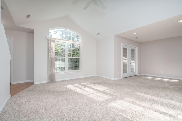 carpeted empty room with baseboards, vaulted ceiling, recessed lighting, french doors, and a ceiling fan