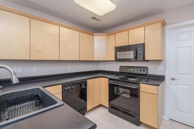 kitchen with visible vents, black appliances, light brown cabinetry, a sink, and dark countertops