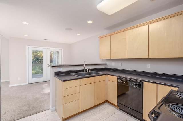 kitchen featuring black appliances, light brown cabinets, and a sink