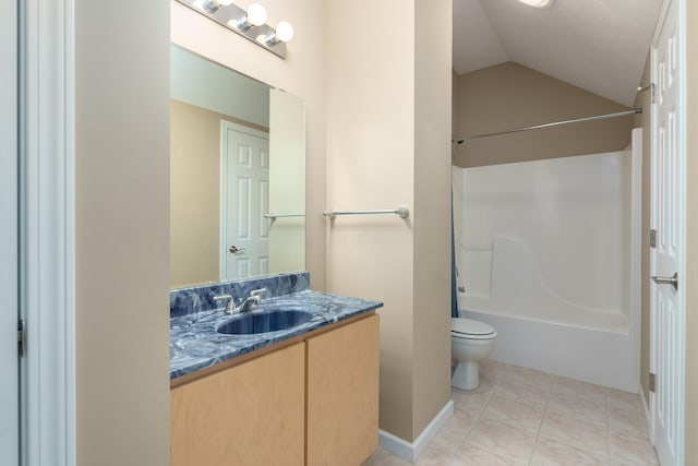 bathroom with toilet, vaulted ceiling, tile patterned floors, vanity, and  shower combination