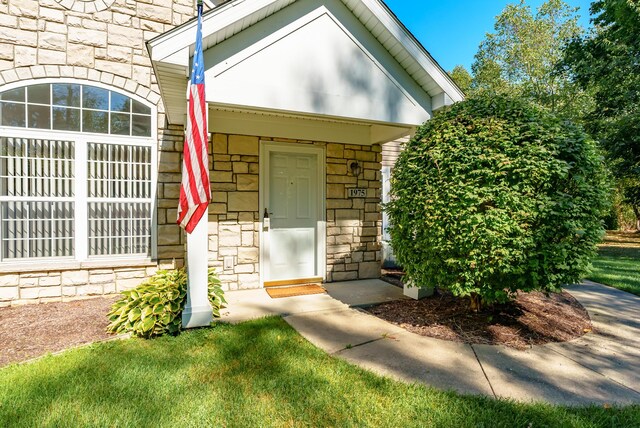 entrance to property with stone siding