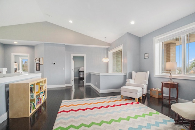 interior space featuring dark wood-style flooring, baseboards, vaulted ceiling, and recessed lighting