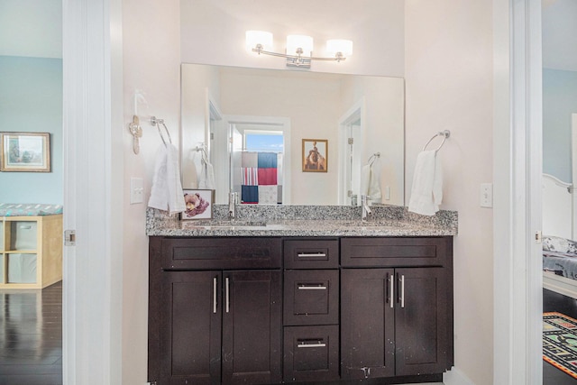 bathroom with double vanity and a sink