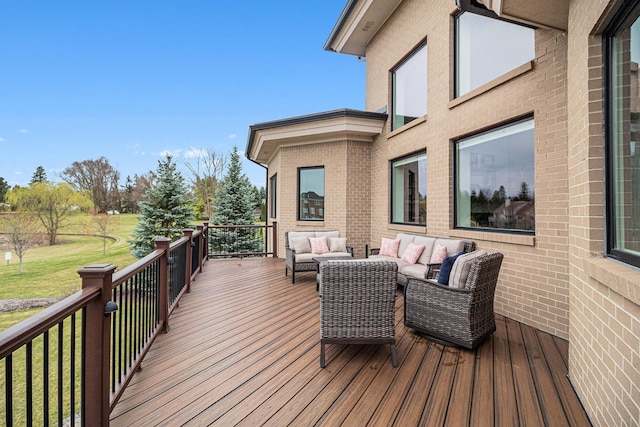 wooden deck with a yard and an outdoor living space