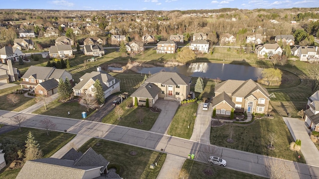 aerial view featuring a water view and a residential view
