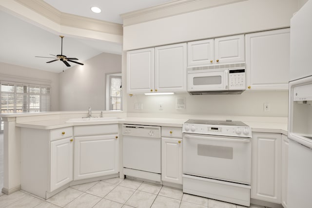 kitchen featuring ceiling fan, light countertops, a peninsula, white appliances, and a sink