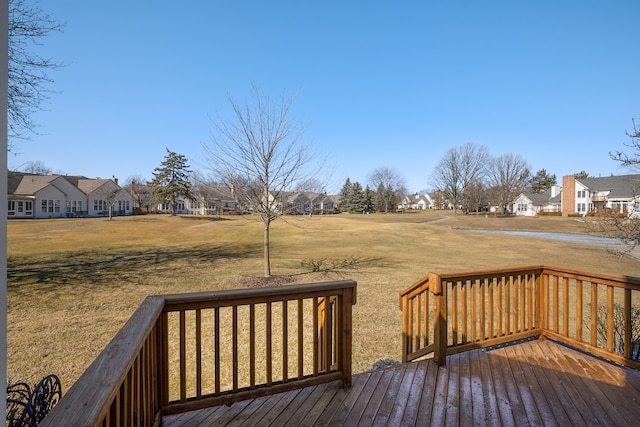 deck featuring a yard and a residential view