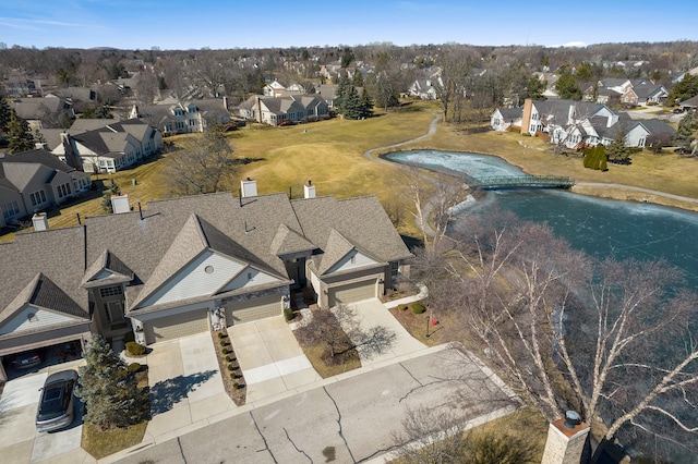 aerial view with a residential view and a water view