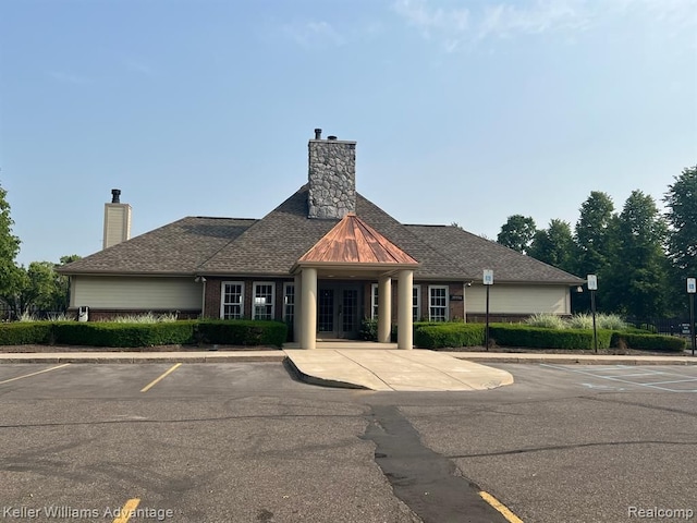 view of property featuring uncovered parking