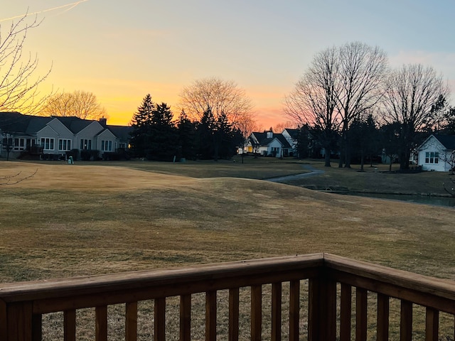 yard at dusk with a residential view