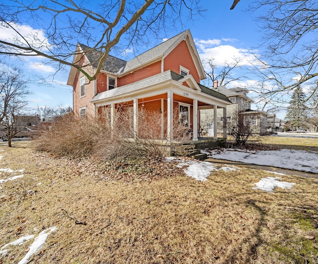 view of property exterior with covered porch