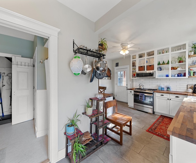 kitchen with open shelves, wood counters, tasteful backsplash, white cabinetry, and stainless steel appliances