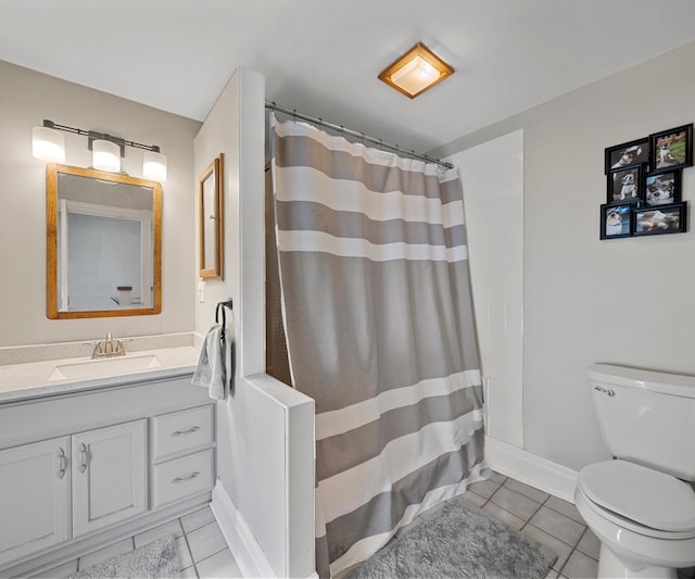 bathroom featuring curtained shower, baseboards, toilet, tile patterned floors, and vanity