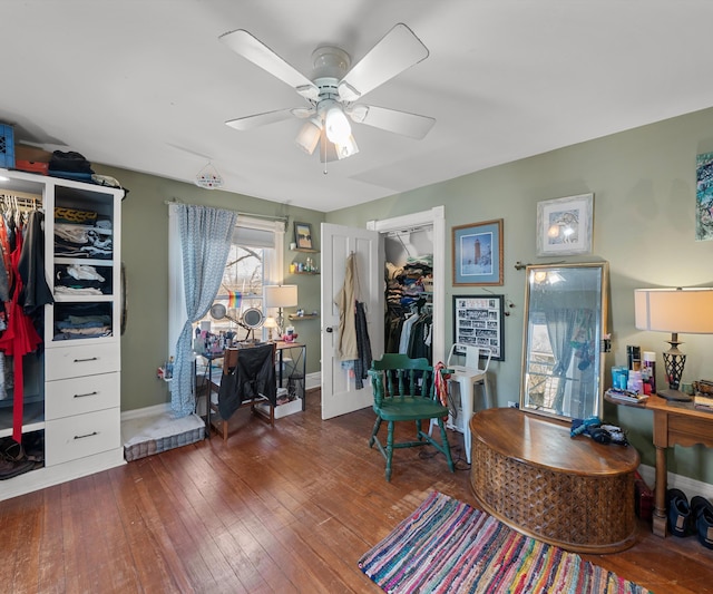 office area featuring ceiling fan, baseboards, and hardwood / wood-style floors