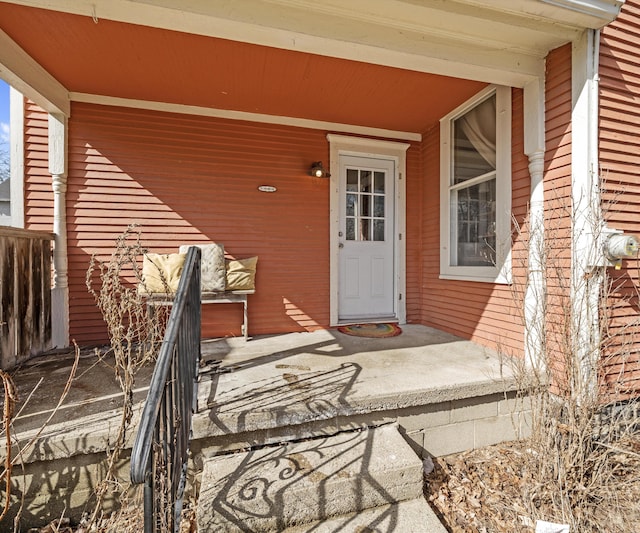 entrance to property featuring a porch