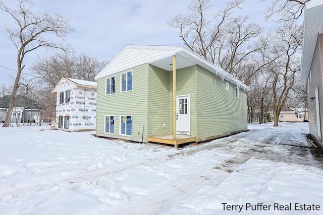 view of snow covered house