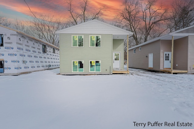 view of snow covered house