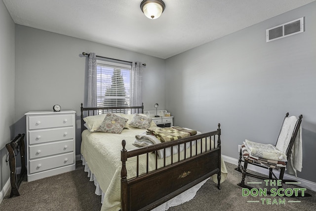 carpeted bedroom with visible vents and baseboards