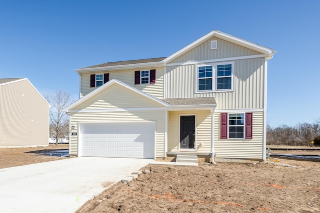 traditional home with an attached garage, concrete driveway, and board and batten siding