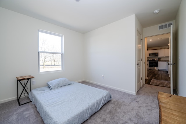 bedroom with visible vents, baseboards, and carpet