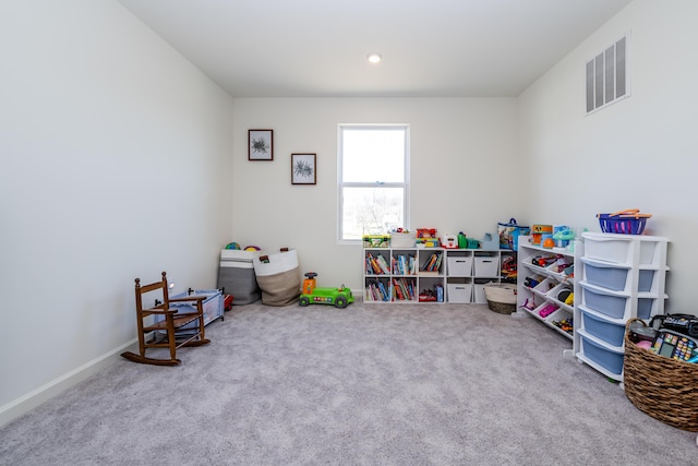 rec room featuring visible vents, baseboards, and carpet flooring