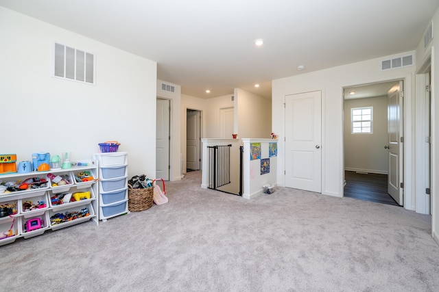 recreation room featuring carpet flooring, recessed lighting, and visible vents