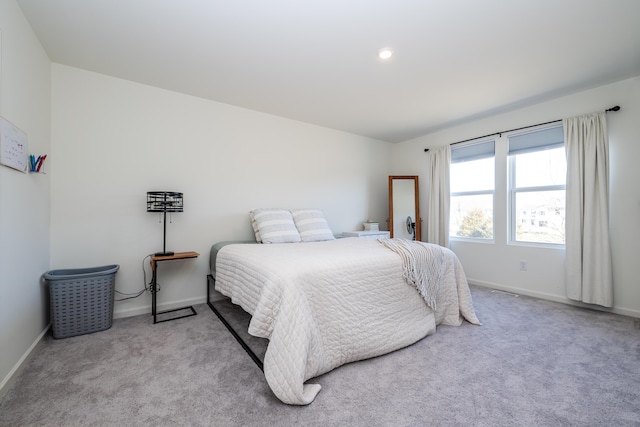 bedroom with baseboards and carpet flooring