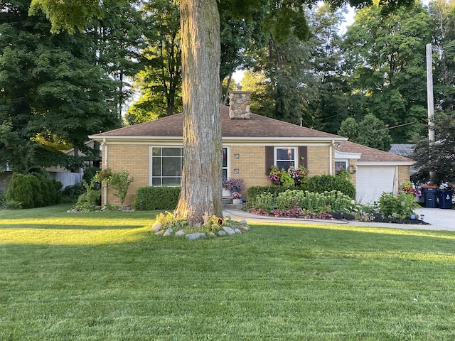 ranch-style house with a garage, a front yard, brick siding, and a chimney