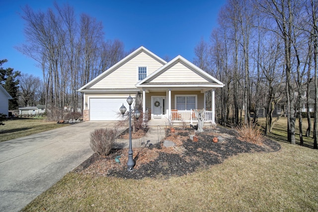 view of front facade with a porch, concrete driveway, and a front yard