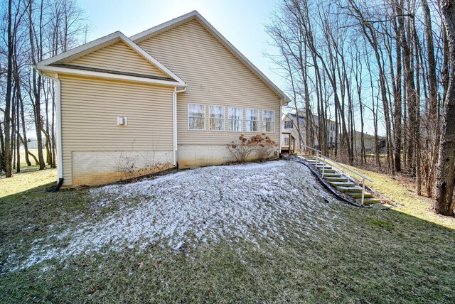 view of home's exterior featuring stairs