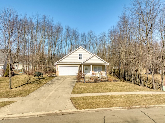 traditional-style house featuring covered porch, an attached garage, concrete driveway, and a front lawn