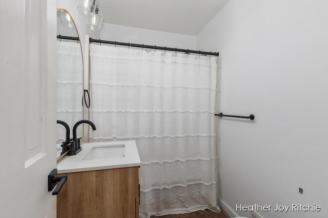 bathroom featuring vanity and a shower with shower curtain