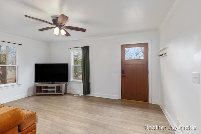 entryway with light wood-style flooring, baseboards, and ceiling fan