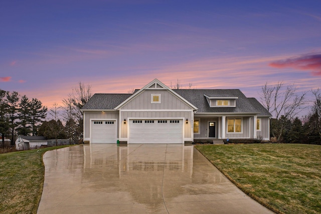 view of front of property with board and batten siding, covered porch, a lawn, a garage, and driveway