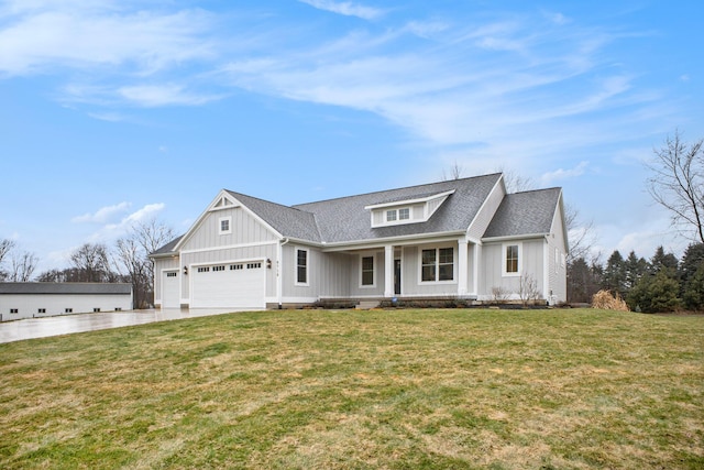 modern farmhouse featuring a front yard, a porch, a shingled roof, concrete driveway, and board and batten siding