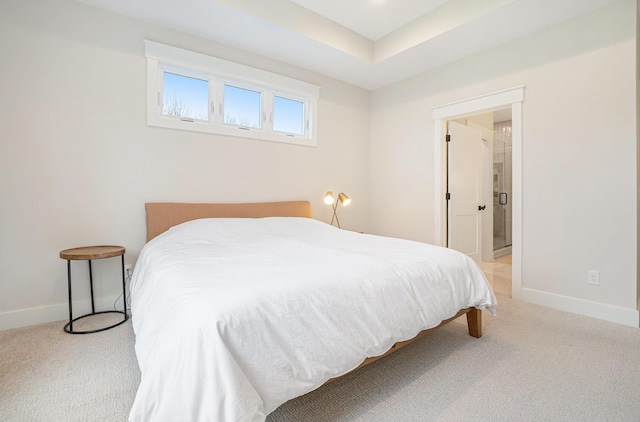 bedroom featuring baseboards and light carpet