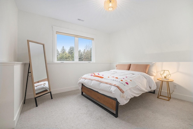 bedroom featuring visible vents, baseboards, and carpet floors