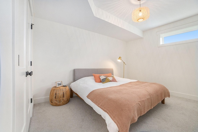 bedroom featuring baseboards and carpet floors