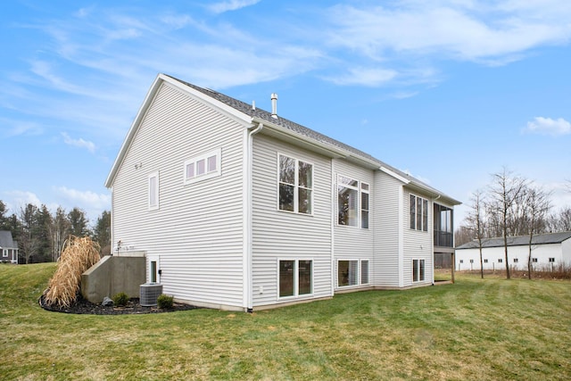 back of house featuring a yard