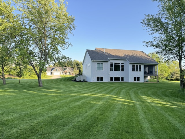 rear view of house with a lawn