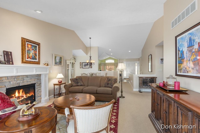 living room featuring visible vents, high vaulted ceiling, a notable chandelier, a fireplace, and light colored carpet