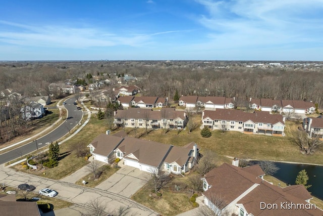 birds eye view of property with a residential view and a water view