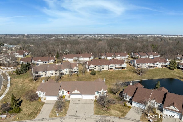 drone / aerial view with a residential view and a water view