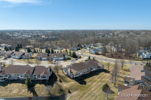 birds eye view of property with a residential view