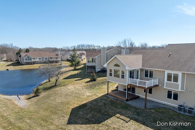 birds eye view of property featuring a residential view and a water view