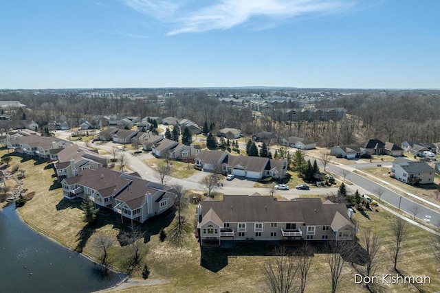 birds eye view of property featuring a residential view and a water view