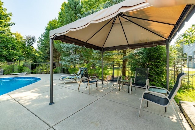 view of swimming pool featuring a fenced in pool, fence, and a patio area