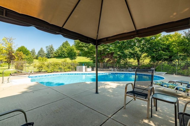 view of swimming pool with a gazebo, a fenced in pool, a patio, and fence